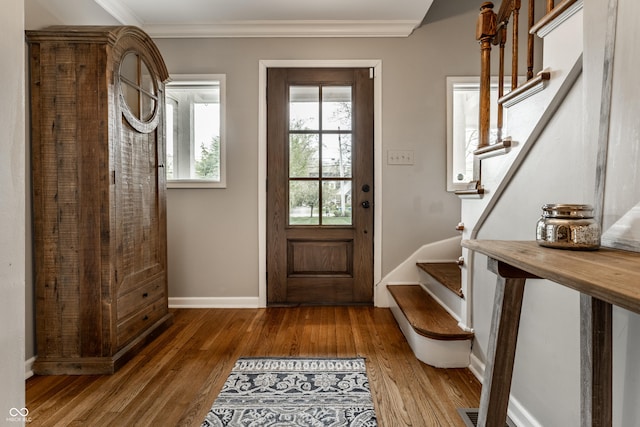 440 E 82nd St, Indianapolis, IN 46240 - doorway to outside featuring stairway, wood finished floors, ornamental molding, and baseboards
