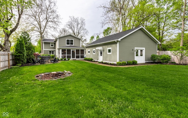 440 E 82nd St, Indianapolis, IN 46240 - back of house featuring a sunroom, a fire pit, a chimney, and roof with shingles