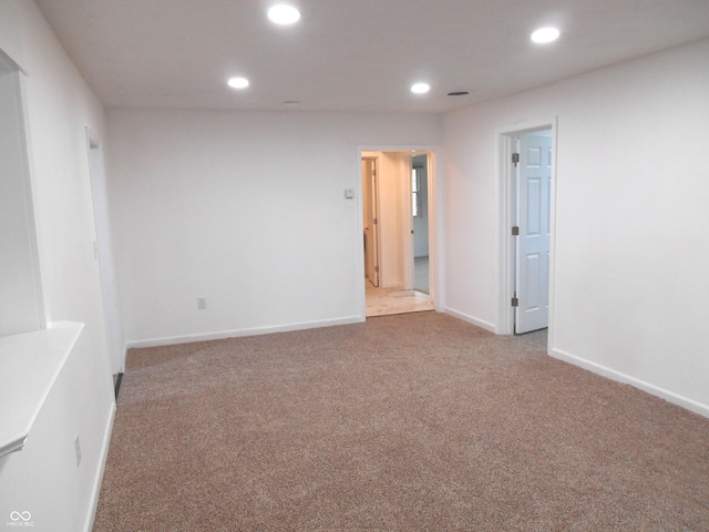carpeted spare room with recessed lighting and baseboards