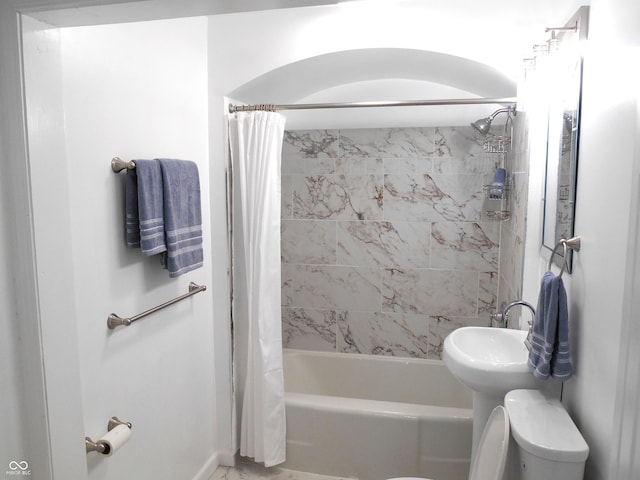 full bathroom featuring shower / bath combination with curtain and toilet