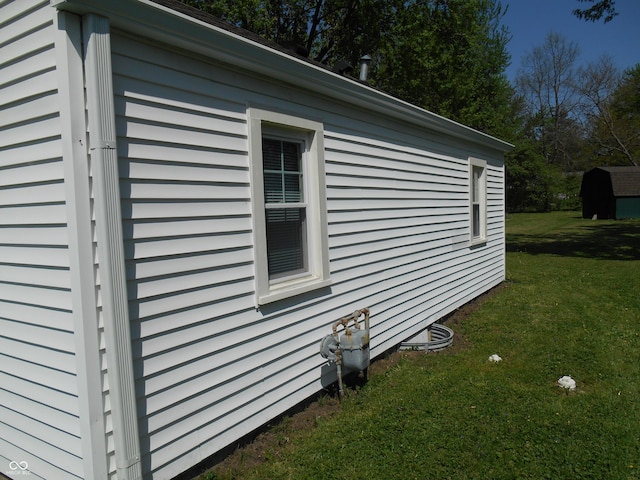 view of property exterior with a yard