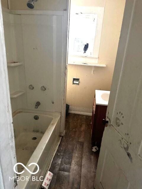 bathroom with vanity, wood-type flooring, and bathtub / shower combination