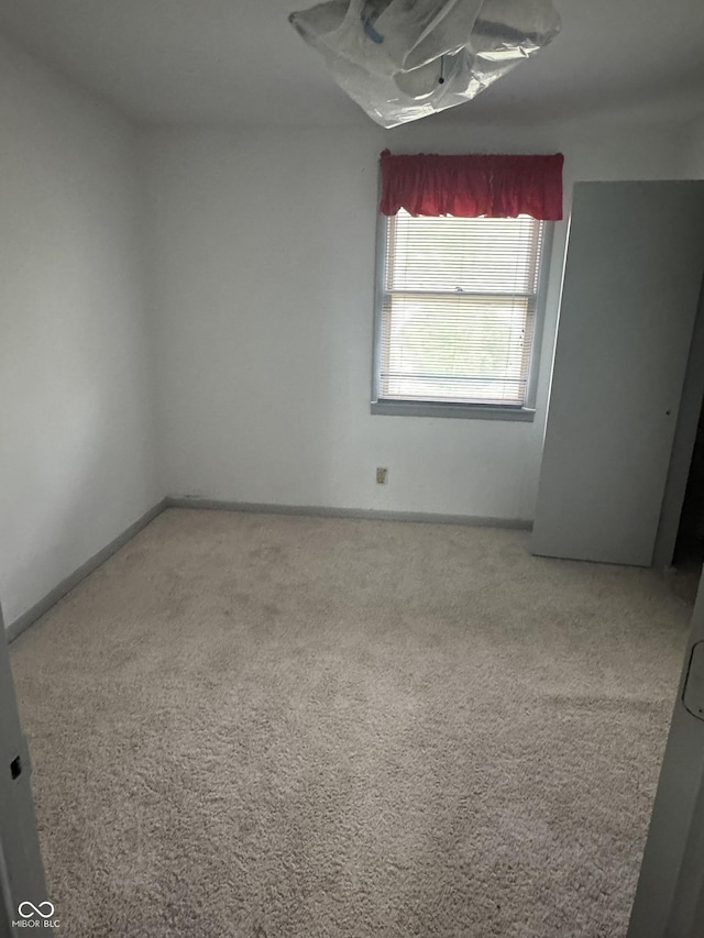 2425 S Lyons Ave, Indianapolis, IN 46241 - carpeted spare room with baseboards