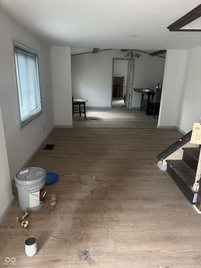 2425 S Lyons Ave, Indianapolis, IN 46241 - interior space with baseboards, visible vents, wood finished floors, and stairway
