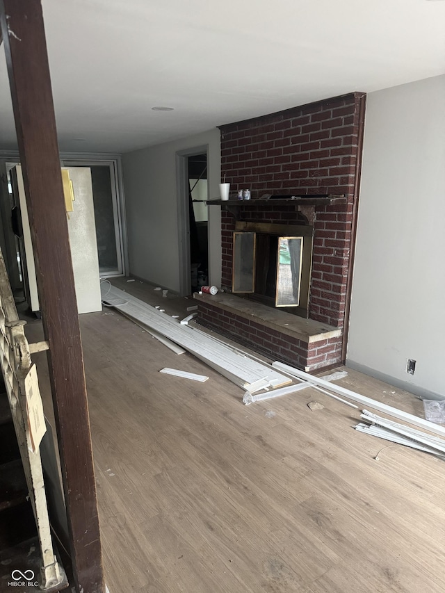 2425 S Lyons Ave, Indianapolis, IN 46241 - unfurnished living room with wood finished floors and a fireplace