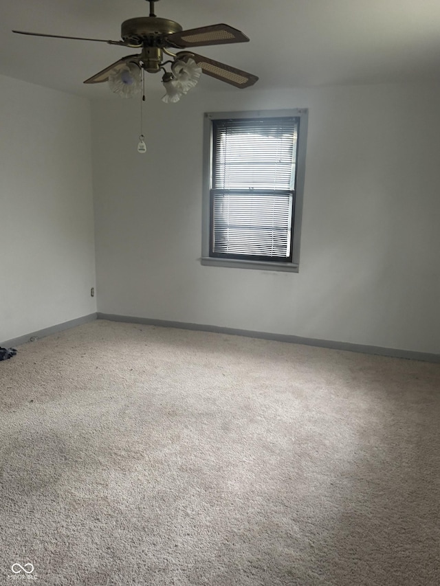2425 S Lyons Ave, Indianapolis, IN 46241 - unfurnished room featuring a ceiling fan, baseboards, and carpet