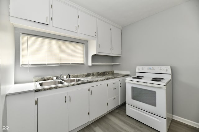 3109 Forest Manor Ave, Indianapolis, IN 46218 - kitchen with a sink, white cabinets, light wood-style floors, and white electric stove