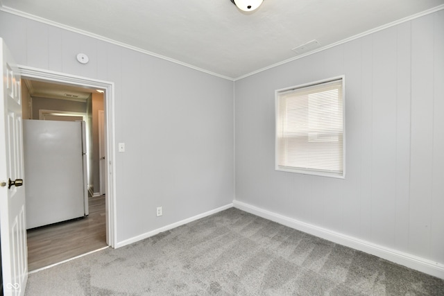 3109 Forest Manor Ave, Indianapolis, IN 46218 - empty room featuring carpet flooring, baseboards, and ornamental molding