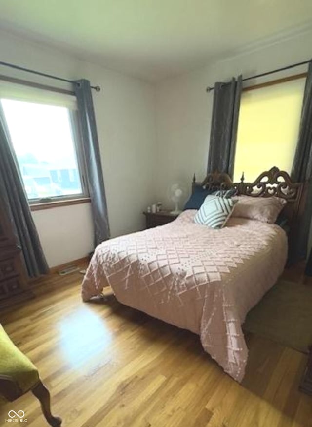 bedroom featuring wood finished floors