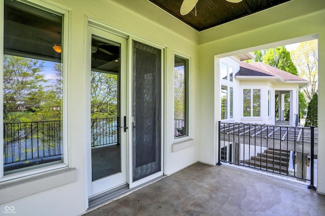 exterior space featuring a ceiling fan