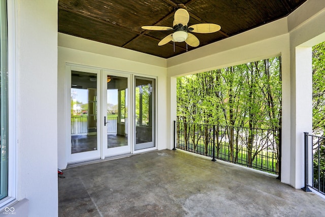 view of patio / terrace featuring a ceiling fan and a water view