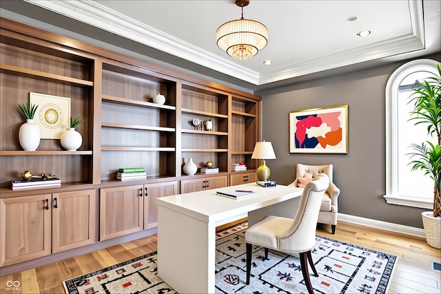 home office with light wood-type flooring, baseboards, crown molding, and a notable chandelier