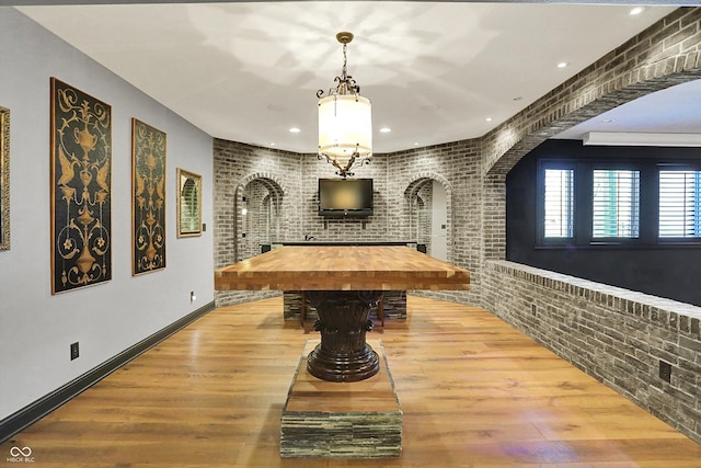 playroom featuring arched walkways, brick wall, recessed lighting, pool table, and wood finished floors