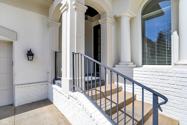 property entrance with brick siding