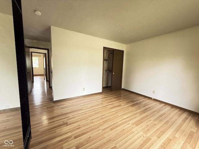 645 Boulder Rd, Indianapolis, IN 46217 - empty room with light wood-style floors and baseboards