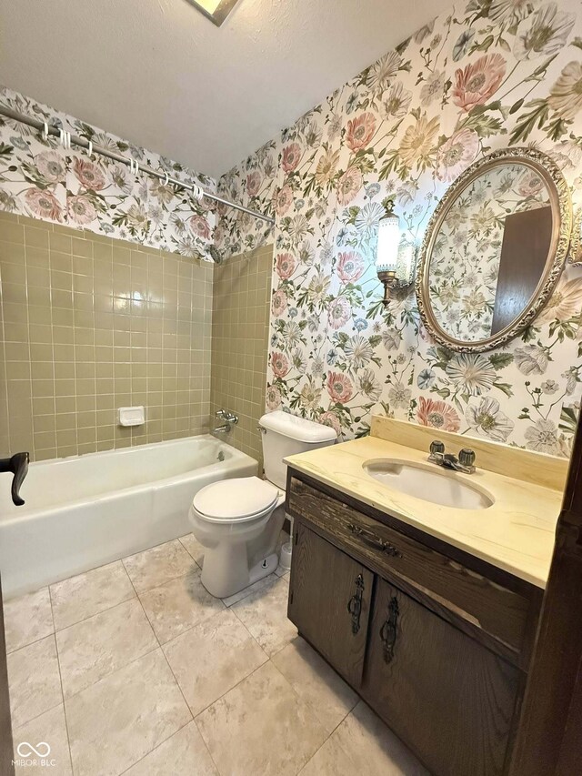 645 Boulder Rd, Indianapolis, IN 46217 - bathroom with tile patterned flooring, bathtub / shower combination, vanity, toilet, and wallpapered walls