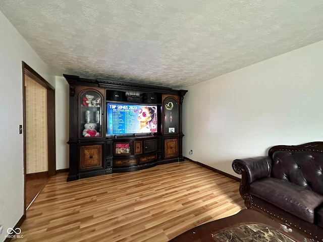 645 Boulder Rd, Indianapolis, IN 46217 - living room with baseboards, a textured ceiling, and wood finished floors