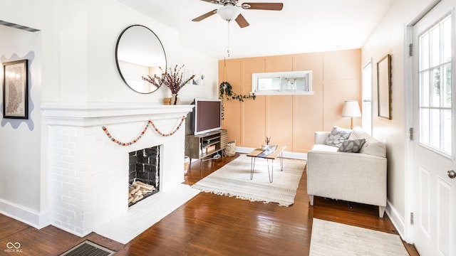 4406 Carrollton Ave, Indianapolis, IN 46205 - living room featuring wood finished floors, ceiling fan, and a fireplace
