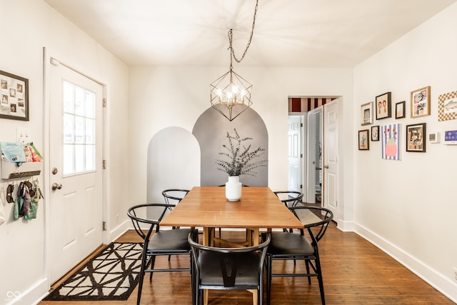 4406 Carrollton Ave, Indianapolis, IN 46205 - dining space featuring dark wood finished floors and a chandelier