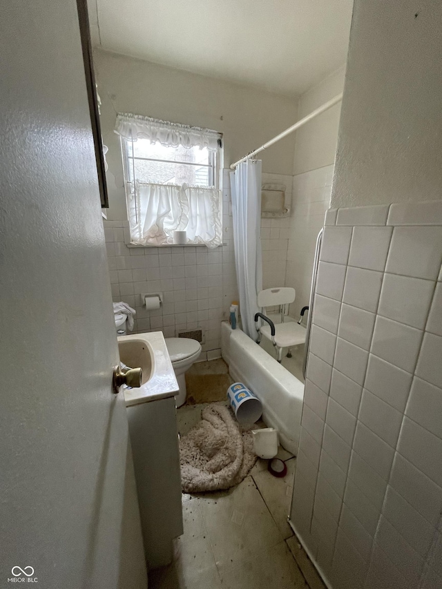 full bath featuring tile walls, vanity, toilet, and shower / bath combination with curtain