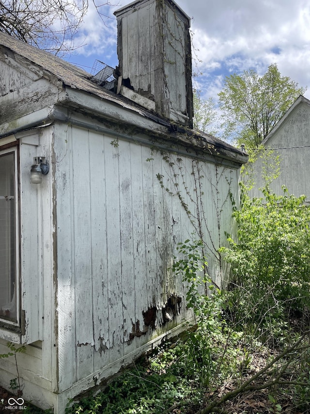 view of side of property with a chimney