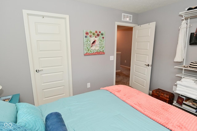 bedroom with visible vents