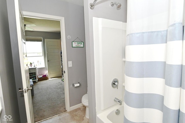 bathroom with toilet and shower / bath combo