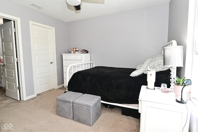bedroom featuring visible vents, carpet flooring, baseboards, and a ceiling fan