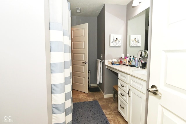 bathroom featuring vanity and a shower with curtain