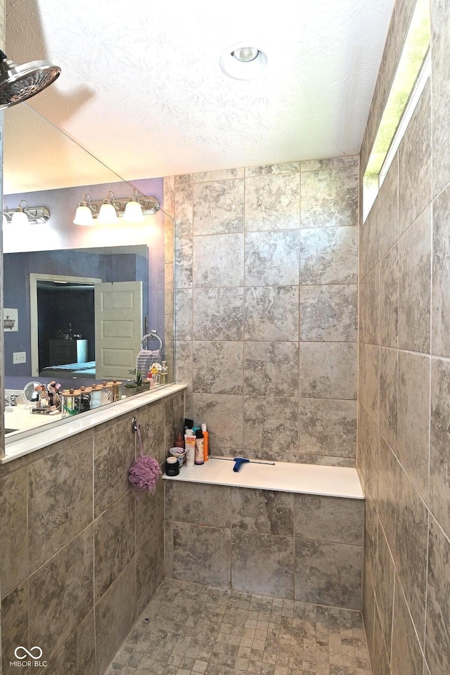 bathroom with a tile shower