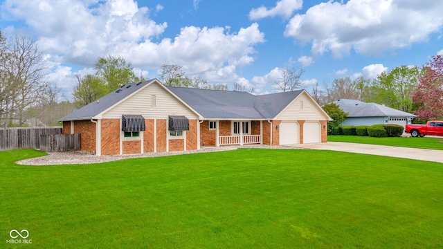 view of front facade with brick siding, a front lawn, fence, and concrete driveway