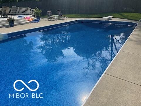 view of swimming pool featuring a patio, a diving board, fence, and a fenced in pool