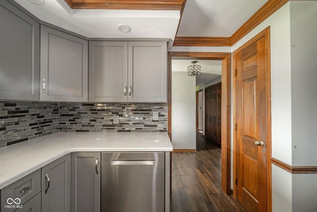 kitchen featuring decorative backsplash, gray cabinets, dark wood-style flooring, and dishwasher
