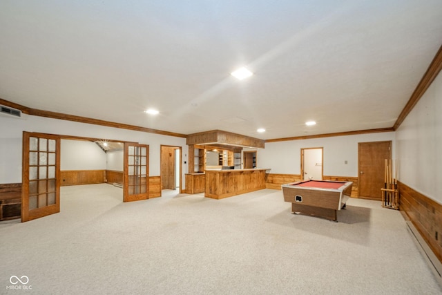 rec room with visible vents, wainscoting, french doors, and light carpet