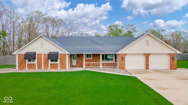 single story home featuring a garage, a front yard, driveway, and brick siding