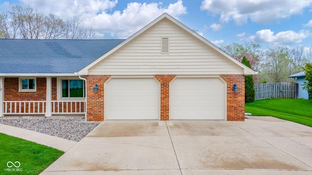 single story home featuring a garage, fence, driveway, and brick siding