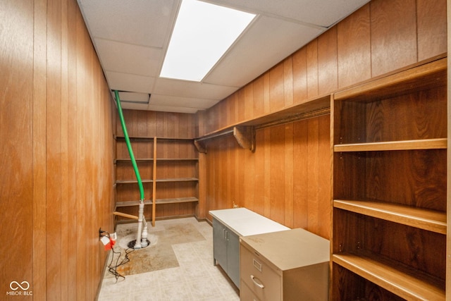 walk in closet with a paneled ceiling