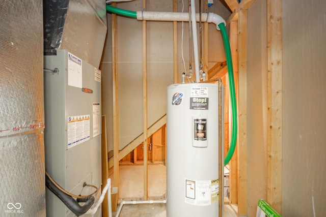 utility room featuring heating unit and water heater