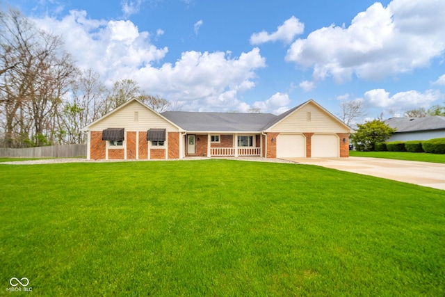 view of front of property featuring driveway, a front yard, brick siding, fence, and an attached garage