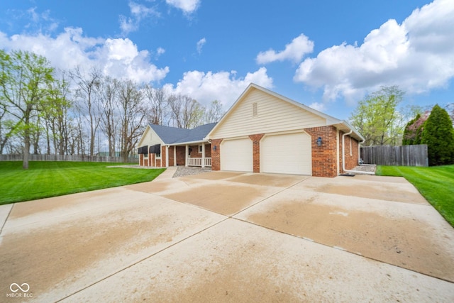 ranch-style home with fence, covered porch, a front yard, brick siding, and an attached garage