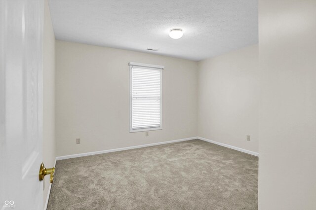 10746 Gateway Dr, Fishers, IN 46037 - empty room featuring carpet flooring, baseboards, and a textured ceiling