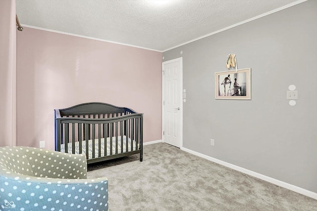 10746 Gateway Dr, Fishers, IN 46037 - bedroom with carpet flooring, crown molding, a textured ceiling, baseboards, and a nursery area