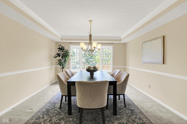 10746 Gateway Dr, Fishers, IN 46037 - carpeted dining space with a tray ceiling, a chandelier, baseboards, and ornamental molding