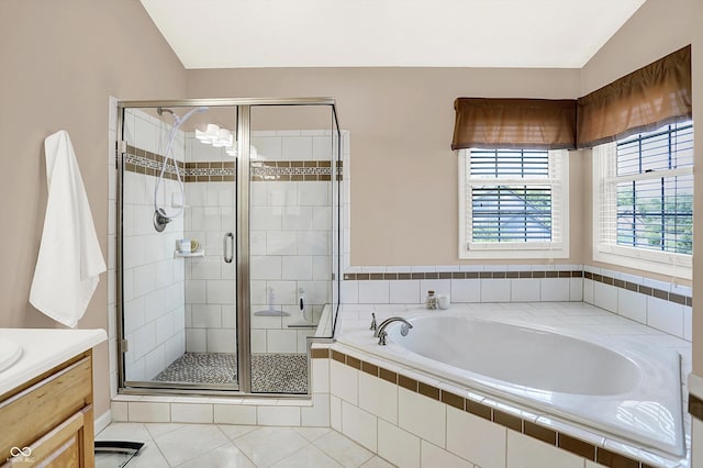 10746 Gateway Dr, Fishers, IN 46037 - bathroom featuring a garden tub, vanity, a stall shower, and tile patterned floors