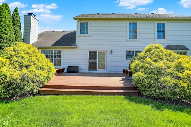 10746 Gateway Dr, Fishers, IN 46037 - back of house with a lawn, a chimney, a shingled roof, and a deck