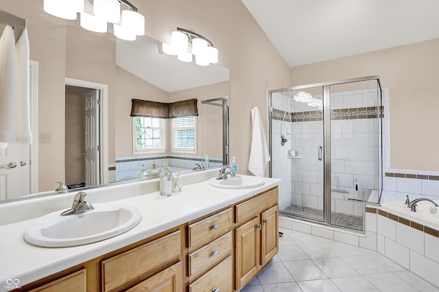 10746 Gateway Dr, Fishers, IN 46037 - full bath with vaulted ceiling, a bath, a shower stall, double vanity, and tile patterned floors