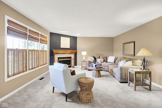 10746 Gateway Dr, Fishers, IN 46037 - living area featuring carpet floors, baseboards, and a tiled fireplace