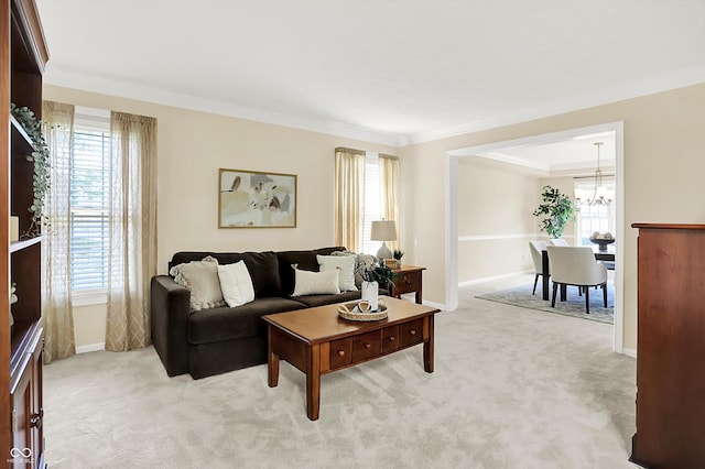 10746 Gateway Dr, Fishers, IN 46037 - living area featuring crown molding, healthy amount of natural light, a chandelier, and baseboards
