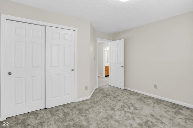 10746 Gateway Dr, Fishers, IN 46037 - unfurnished bedroom featuring carpet floors, baseboards, and a closet