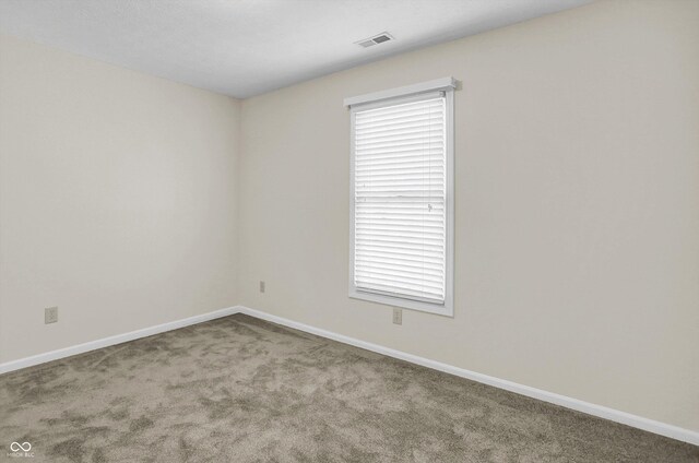 10746 Gateway Dr, Fishers, IN 46037 - empty room featuring carpet and baseboards